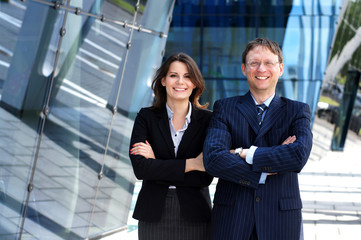 A couple of young business persons in formal clothes