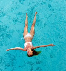 Young woman swiming in sea..