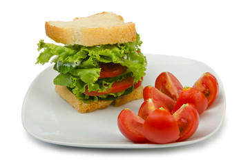 Tomatoes and cucumbers on white