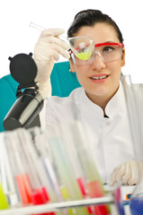 Female chemist in studio on white