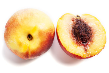 Whole and sliced nectarines