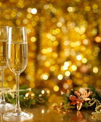 Glass of wine with a Christmas decor in the background.
