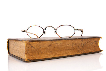 Old book with glasses