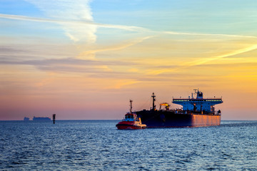 Seascape - Tanker ship at sunrise.