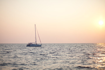 yacht at sea in sunset