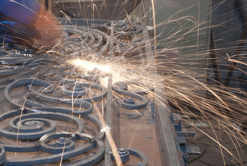 Worker welding metal. Production and construction
