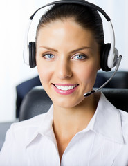 Portrait of female support phone operator at workplace