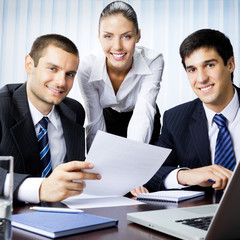 Three businesspeople working at office
