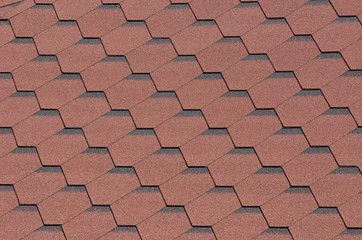 Red bituminous roof tiles background