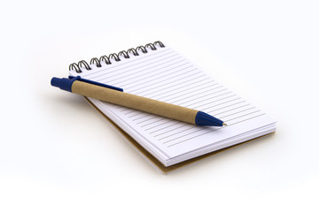 Note book with pen on white background