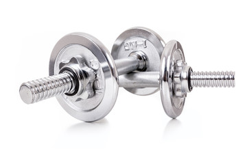 Chromed dumbbells weights over white background