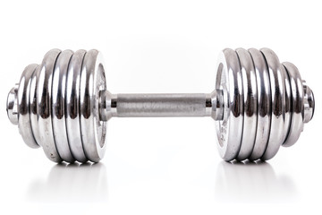 Chromed dumbbell weight over white background