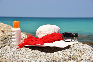 Hat and sunglasses on the rock. Phuket island, Thailand