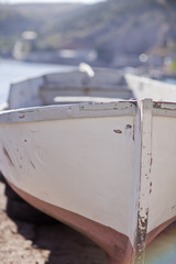 Abandoned fishing boat by the beach side