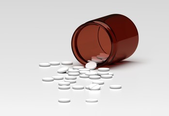 Rozsypane tabletki - pigułki na białym tle