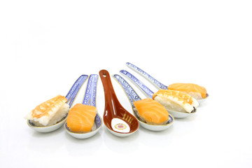 spoons with sushi - one is empty (for free interpretation)