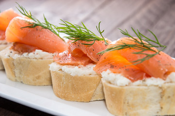 Baguette with Salmon on wood