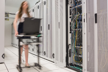 Woman pushing computer to open servers
