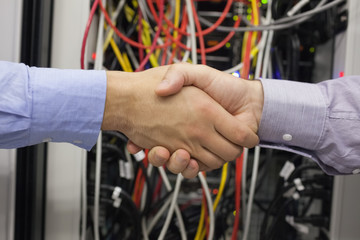 Hand shake in front of wires