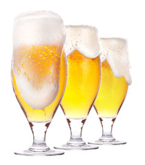 Frosty glass of light beer isolated