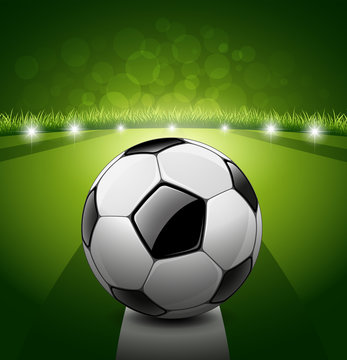 Soccer ball on green grass background, vector illustration