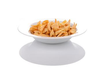 Potato chips on a plate, isolated on white