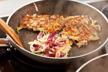 vegetables pancakes on the pan