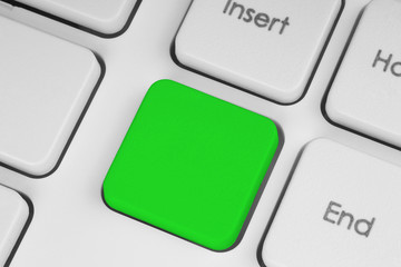 Blank green button on the keyboard close-up