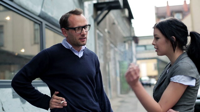 Young business people during cigarette break 