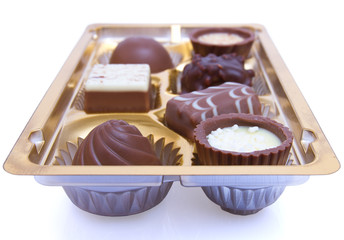 Chocolate sweets in box close up
