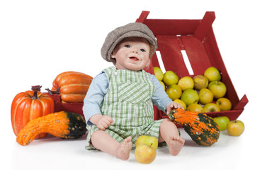 Fototapeta premium Baby Puppe mit Kürbise