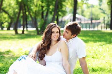 Young love Couple smiling under blue sky