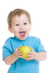 Baby boy holding and eating green apple, isolated on white