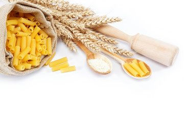 Pasta in a canvas bag and ear on white background.