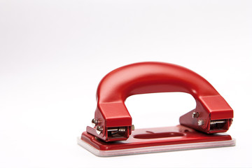 Red office paper hole puncher