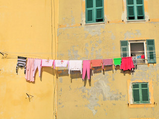 Clothes on the line along windows. Camogli, Italy
