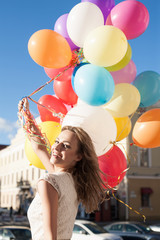 Obraz na płótnie Canvas kobieta z balonami