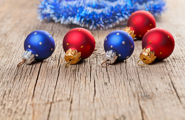 Small New Year decoration balls on old wooden background