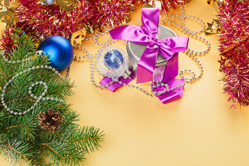 New Year present and decorations on yellow background