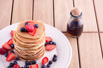 stack of pancakes with strawberry and blueberry