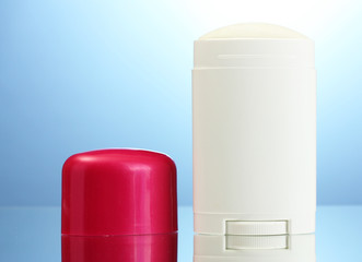 deodorant on blue background