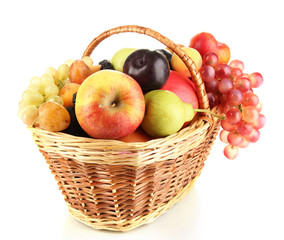 Still life of fruit in basket isolated on white