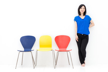 Fototapeta premium a young asian woman with colorful chair