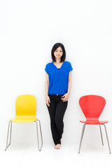 a young asian woman with colorful chair