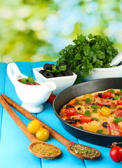 colorful composition of delicious pizza, vegetables and spices