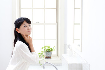 attractive asian woman in the washroom