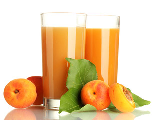 two glasses of apricot juice and apricots with leaves isolated