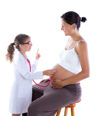 Beautiful pregnant womanand kid girl as stethoscope doctor