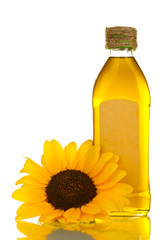 oil in bottle and sunflower, isolated on white