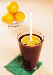 Orange smoothie with blueberries in a glass